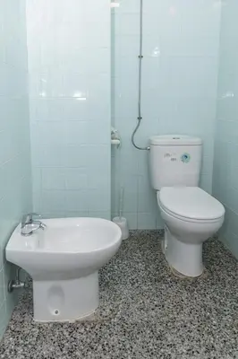 a bathroom with a toilet and a sink at Montemar, B-9º-26 in Cullera