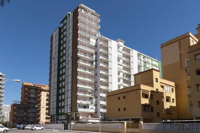 a tall apartment building in a city with buildings at Montemar, B-9º-26 in Cullera