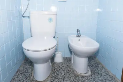 a bathroom with a toilet and a sink at Montemar, C-12º-33 in Cullera