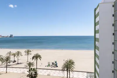 a view of the beach from the balcony of a building at Montemar, C-8º-22 in Cullera