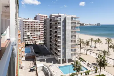 a view of the beach from the balcony of a building at Montemar, C-8º-22 in Cullera