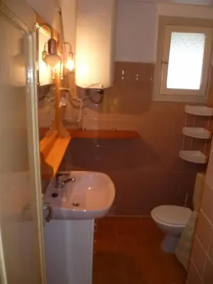 a bathroom with a sink and a toilet at Nautic, 7º-O in Cullera