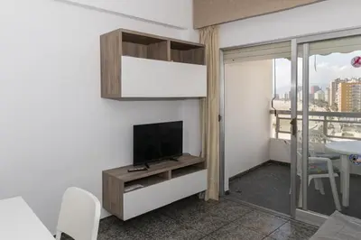a living room with a flat screen tv on a wall at Prado, A-7º-72 in Cullera