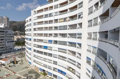 an exterior view of a white building with balconies at Prado, A-7º-72 in Cullera