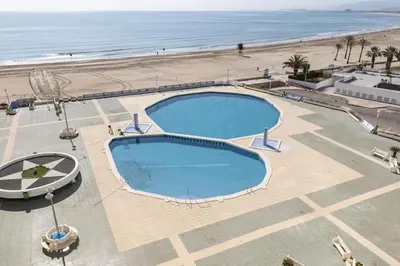 an overhead view of a swimming pool next to a beach at Prado, A-7º-72 in Cullera