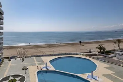 a view of the beach from the balcony of a hotel at Prado, B-6º-64 in Cullera