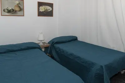 two beds sitting next to each other in a room at Prado, B-6º-64 in Cullera