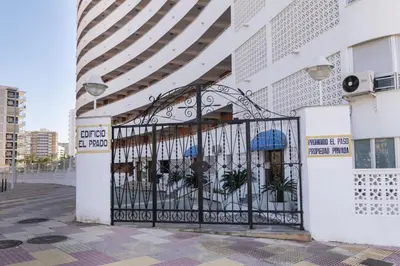 an entrance to a building with an iron gate at Prado, B-6º-64 in Cullera