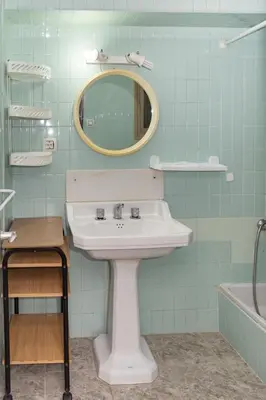 a bathroom with a sink and a mirror and a tub at Provence, 5º-17 in Cullera