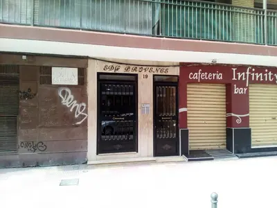 a store front of a building with two doors at Provence, 5º-18 in Cullera