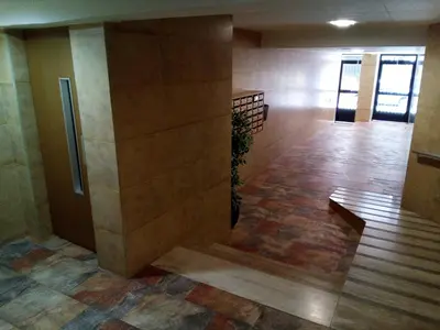 a hallway with a bench in a building at Provence, 5º-18 in Cullera