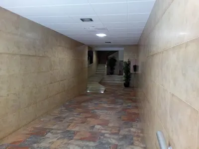 an empty hallway in a office building with stairs at Provence, 5º-18 in Cullera