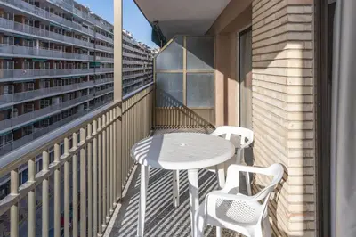 a balcony with a white table and two chairs at Provence, 5º-18 in Cullera