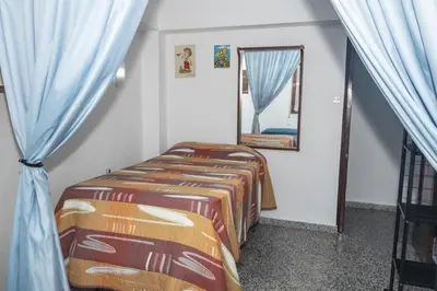 a bedroom with two beds and a mirror at Provence, 7º-25 in Cullera