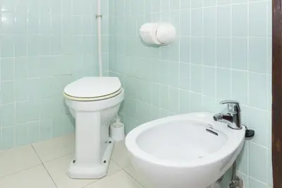 a bathroom with a toilet and a sink at Provence, 7º-25 in Cullera