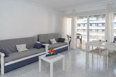 a living room with a couch and a table at Saint Germain 7/B1, 8º-16 in Cullera