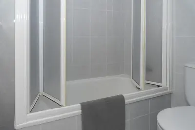 a bathroom with a shower with a toilet and a sink at Saint Germain 7/B1, 8º-16 in Cullera