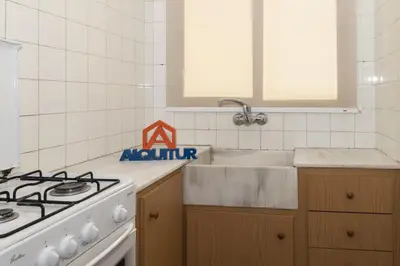 a kitchen with a stove and a sink at Trianon, 5º-29 in Cullera
