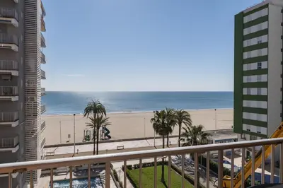 a view of the beach from the balcony of a condo at Trianon, 5º-29 in Cullera