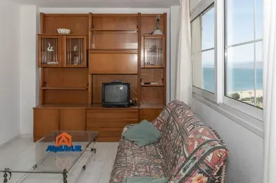 a living room with a couch and a tv at Villas Cap Blanc Ii, Pta 11 in Cullera