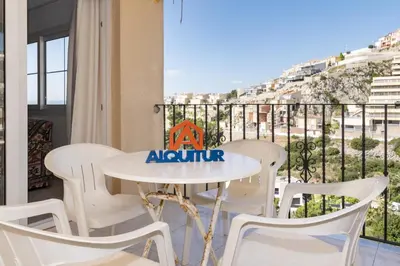 a table and chairs on a balcony with a view at Villas Cap Blanc Ii, Pta 11 in Cullera