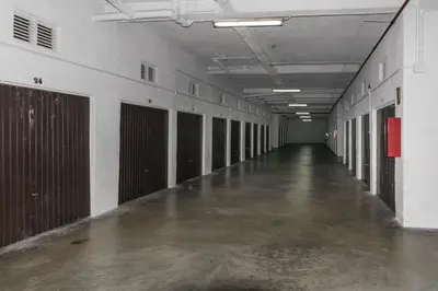 an empty hallway of a building with doors and a concrete floor at Villas Cap Blanc, 1-31 Cab I-36 in Cullera