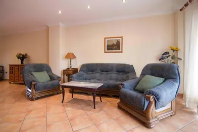 a living room with two couches and a table at Portocanet Complejo Turístico in Canet de Berenguer