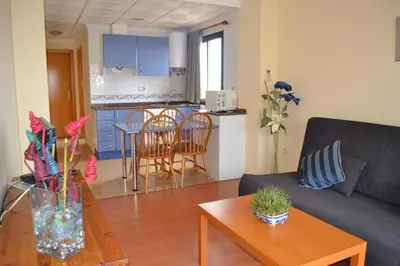 a living room with a couch and a table at Portocanet Complejo Turístico in Canet de Berenguer