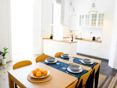 a kitchen with a table with oranges on it at City Hall Correos in Valencia