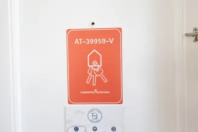 a red sign on the door of a room at FLORIT FLATS - Ruzafa Attic with Private Terrace in Valencia