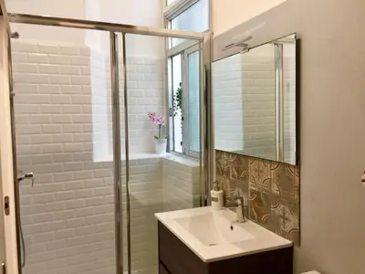 a bathroom with a sink and a shower at Teixidors de Palomar - PalomarGroup in Valencia