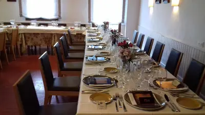 a long dining room with a long table with chairs at Hotel La Carreta in Chiva