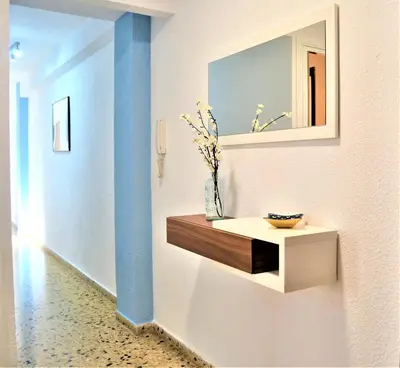 a bathroom with a sink and a mirror on a wall at Casa Victoria in Valencia