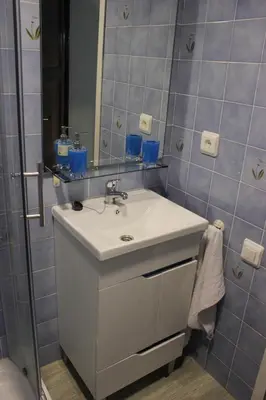a bathroom with a sink and a mirror at Apartment in Little Venice in Port Saplaya