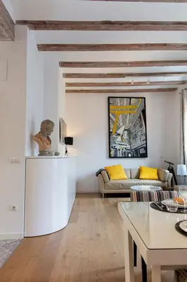 a living room with a couch and a table at FLORIT FLATS - Serranos Apartment in Valencia