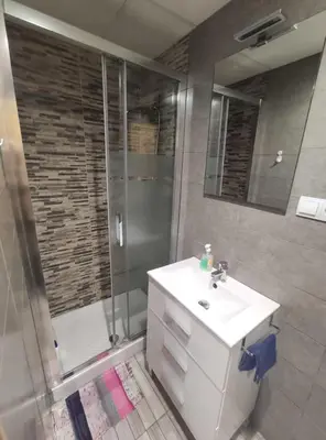 a bathroom with a shower and a sink and a toilet at Apartamento La Marina Real in Valencia