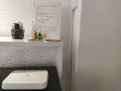 a white toilet sitting on a shelf next to a wall at Apartamento La Marina Real in Valencia