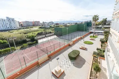 an overhead view of a tennis court in a city at Apartamento Calipso in El Palmar