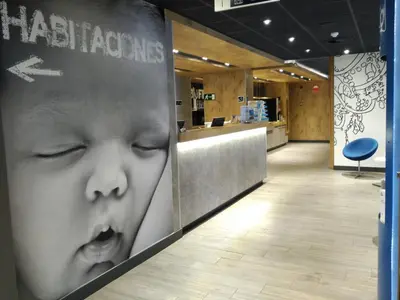 a store with tables and chairs outside of a building at Ibis Budget Valencia Aeropuerto in Manises