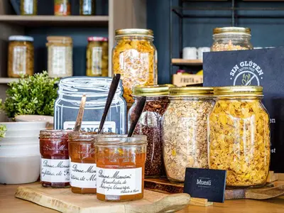 a display of jars of food on a table at Ibis Valencia Bonaire Aeropuerto in Aldaya