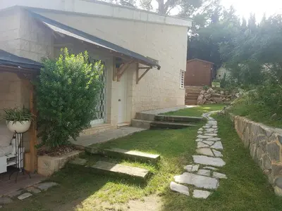 a yard with a stone path next to a house at Domus Valencia Apartamentos Casa con piscina privada a 30 minutos de Valencia in Turís