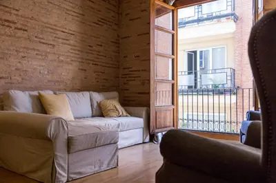 a bathroom with a tub and a sink and a toilet at La Casa Chica del Carmen in Valencia