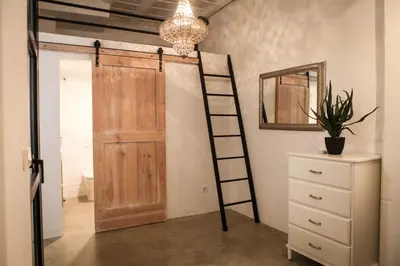 a room with a ladder and a closet with a door at Apartment Triador in Valencia