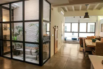 a living room with large sliding glass doors at Apartment Triador in Valencia