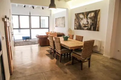 a dining room with a table and chairs at Apartment Triador in Valencia