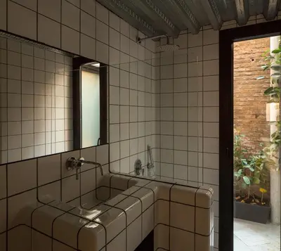 a bathroom with a sink and a mirror at Beach loft in Valencia