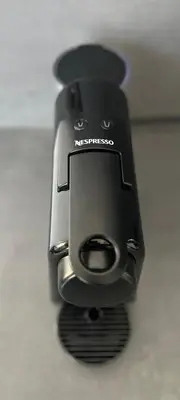 a close up of a cell phone sitting on a table at Mon Suites San Martin in Valencia