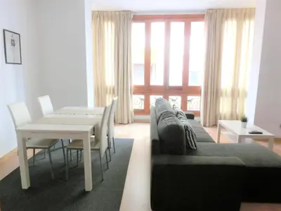 a living room with a couch and a table at Total Valencia Mercat in Valencia