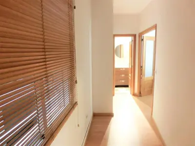 a hallway with a window with blinds on it at Total Valencia Mercat in Valencia
