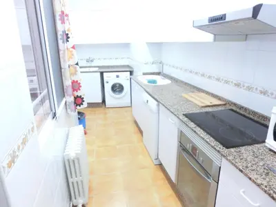 a kitchen with a sink and a washing machine at Total Valencia Mercat in Valencia